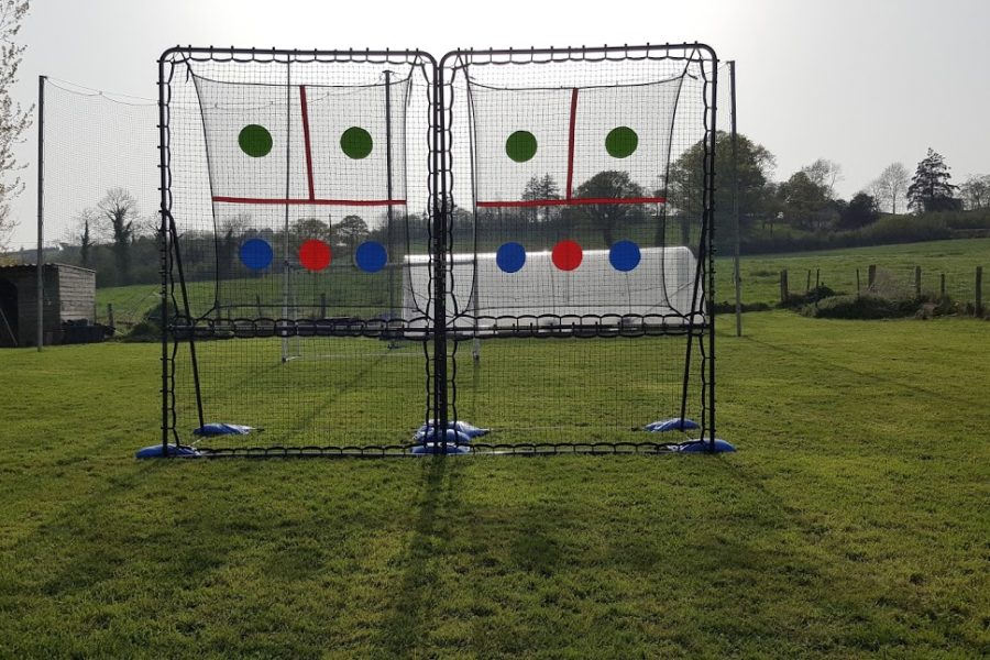 SkillMaster ball rebounders two side by side in home lawn.
