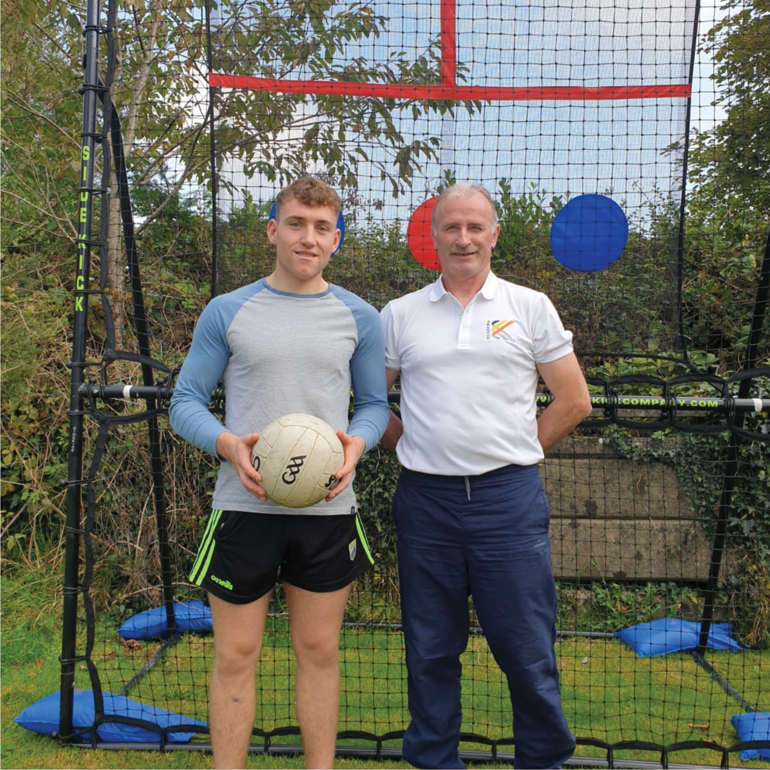 Daragh Moynihan, Kerry Footballer, with Gerry McElligott, Co - Founder of The Kick Co. standing in front of The SkillMaster.