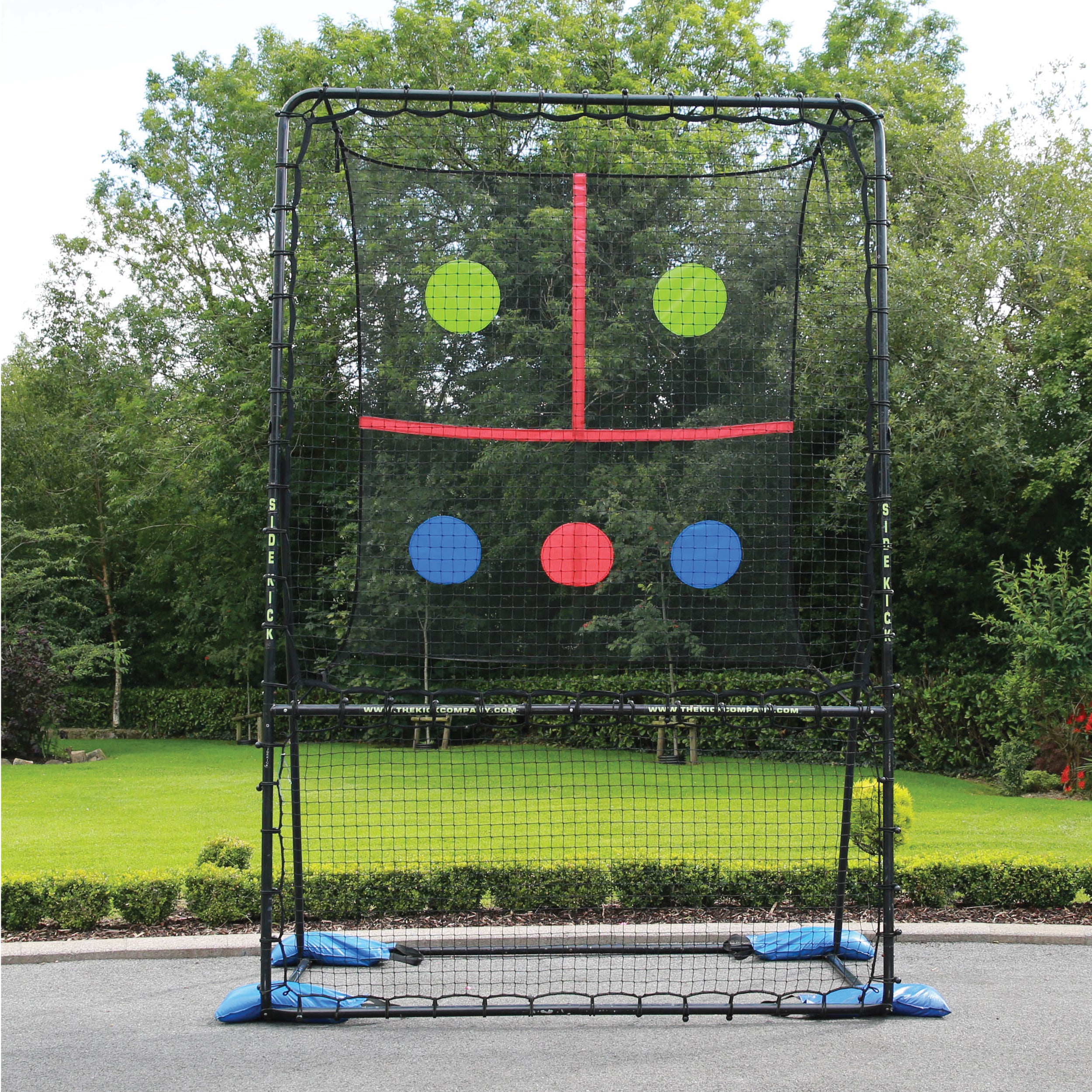 SkillMaster Ball Rebounder on a home front yard.